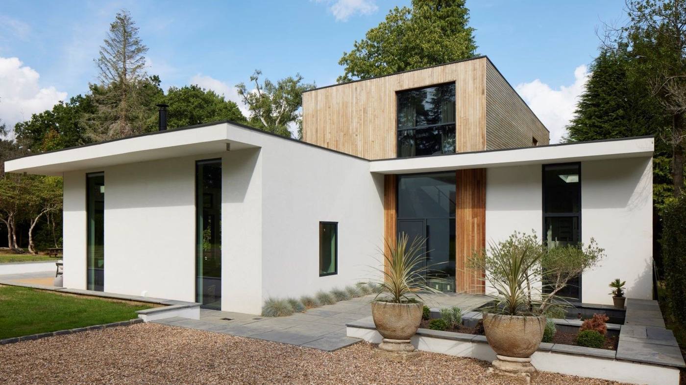 Modern white rendered house with clean patio