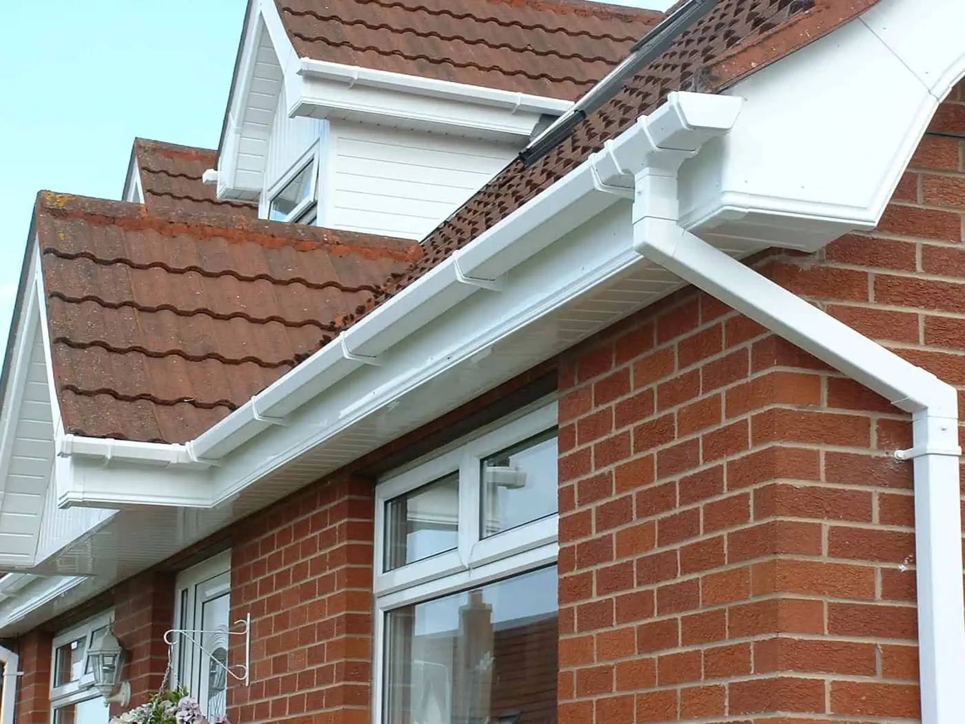 Clean white fascias and gutters on a new roofline