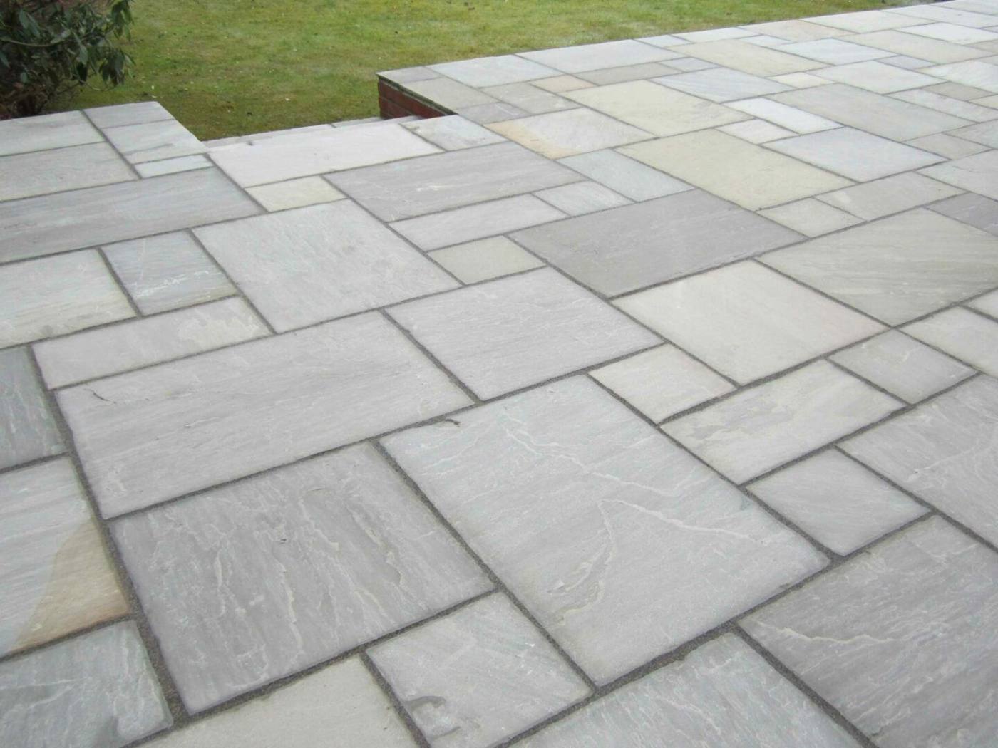 Clean grey sandstone paving slabs