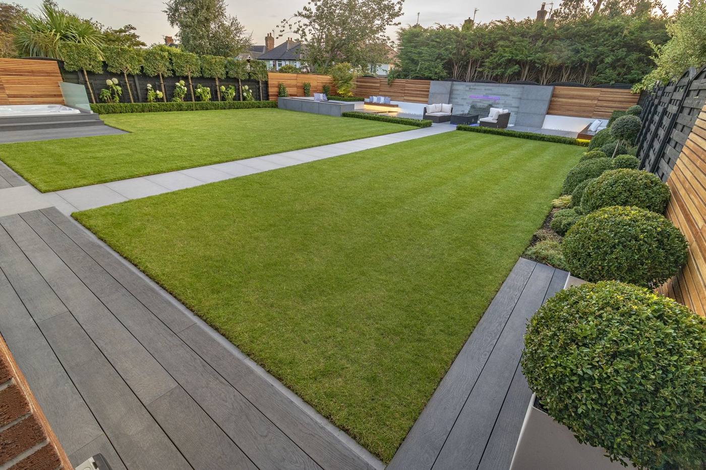 Garden with clean paved paths and lawn