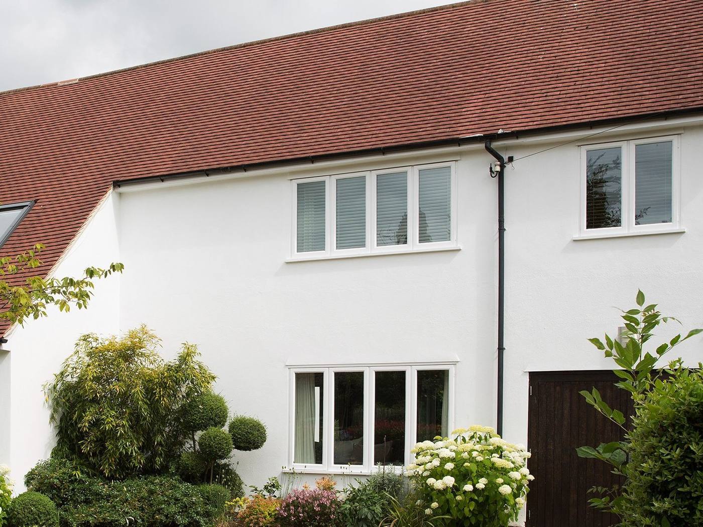 Clean white rendered British house